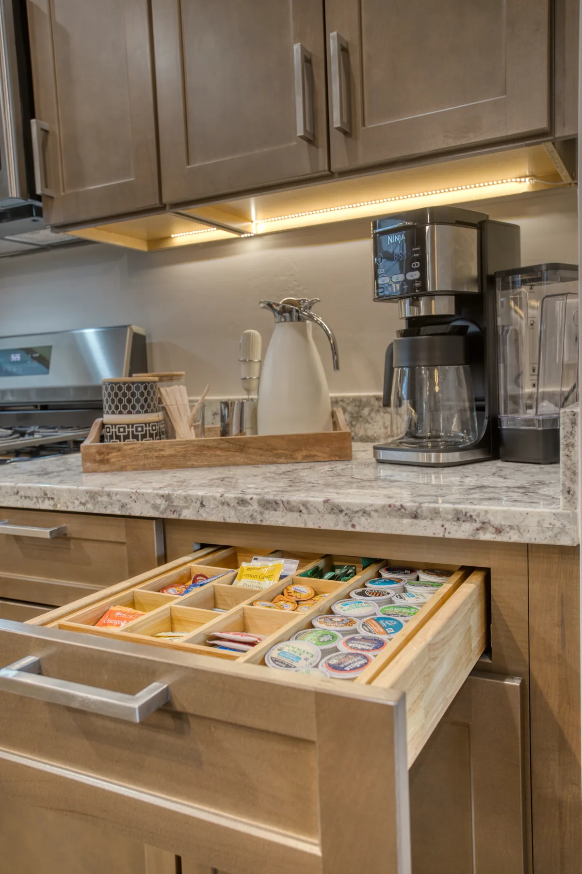 Open drawer of coffee and tea supplies at the Bluff Retreat coffee bar
